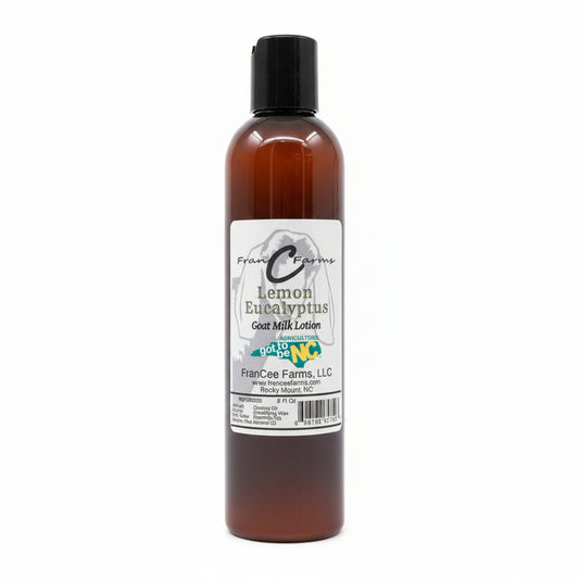 lotion bottle of lemon eucalyptus goat milk lotion on a wooden shelf
