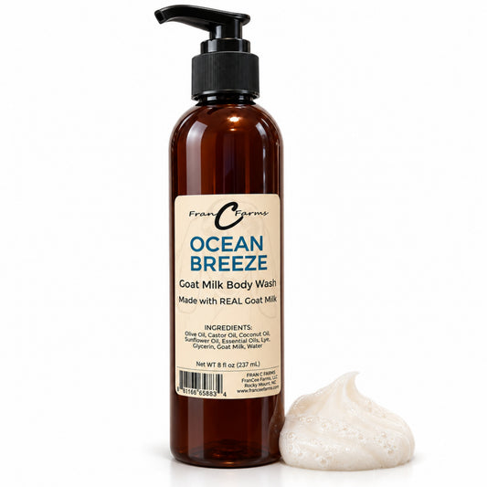 FRAN C FARMS Ocean Breeze goat milk body wash in an amber pump bottle with lather on a white background.