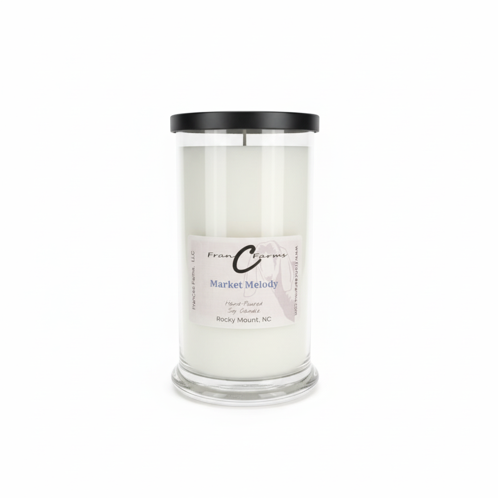Market Melody soy candle in a 22 oz. glass jar with black lid, hand poured in Rocky Mount, NC.
