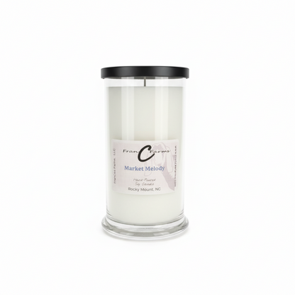 Market Melody soy candle in a 22 oz. glass jar with black lid, hand poured in Rocky Mount, NC.