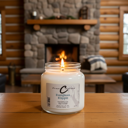 Evergreen & Apple Soy Candle in 18 oz. apothecary jar, glowing softly against a cozy fireplace setting.