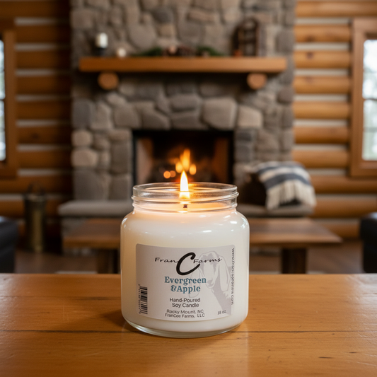 Evergreen & Apple Soy Candle in 18 oz. apothecary jar, glowing softly against a cozy fireplace setting.