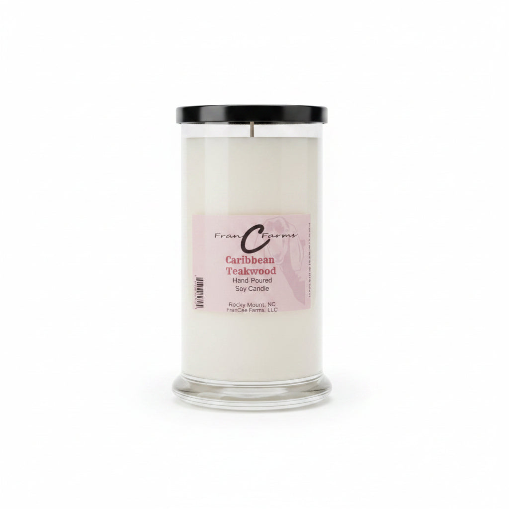 Caribbean Teakwood soy candle in a clear jar with a black lid, showcasing its elegant design and label.