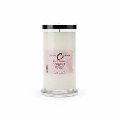 Caribbean Teakwood soy candle in a clear jar with a black lid, showcasing its elegant design and label.