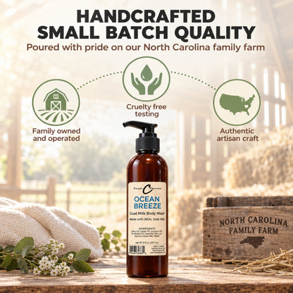 Ocean Breeze goat milk body wash on a wooden table beside a North Carolina family farm crate and a small-batch graphic.