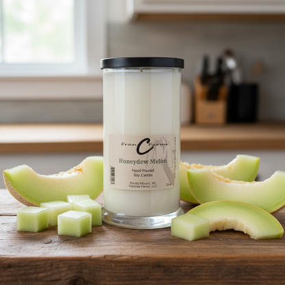 Honeydew Melon Soy Candle - 22 oz. Status Jar on a wooden table with fresh honeydew melon.