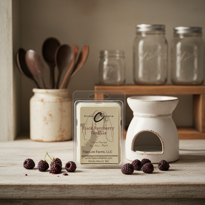 Black Raspberry Vanilla Soy Wax Melts package on a rustic table with fresh black raspberries.