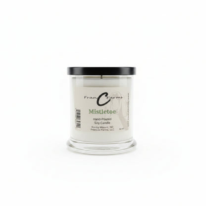 Mistletoe Soy Candle - 12 oz. jar with black lid, perfect for creating a festive holiday atmosphere.