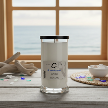 Ocean Breeze Soy Candle in a stylish jar with ocean view in the background, perfect for a coastal ambiance.