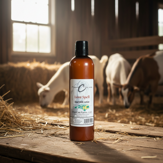 Love Spell Goat Milk Lotion bottle with goats in barn setting, showcasing natural ingredients and soothing fragrance.