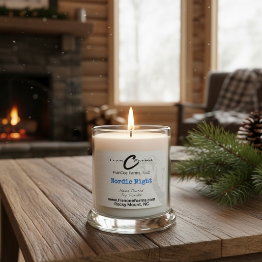 Nordic Night soy candle in a cozy setting with snowy backdrop and pine decor, ideal for creating a fresh winter atmosphere.